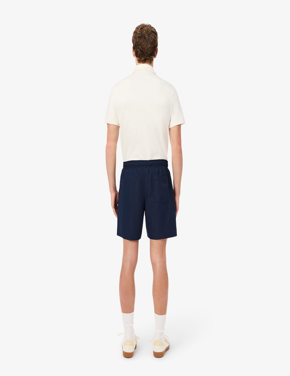 Traje de baño Lacoste con bolsillos para hombre